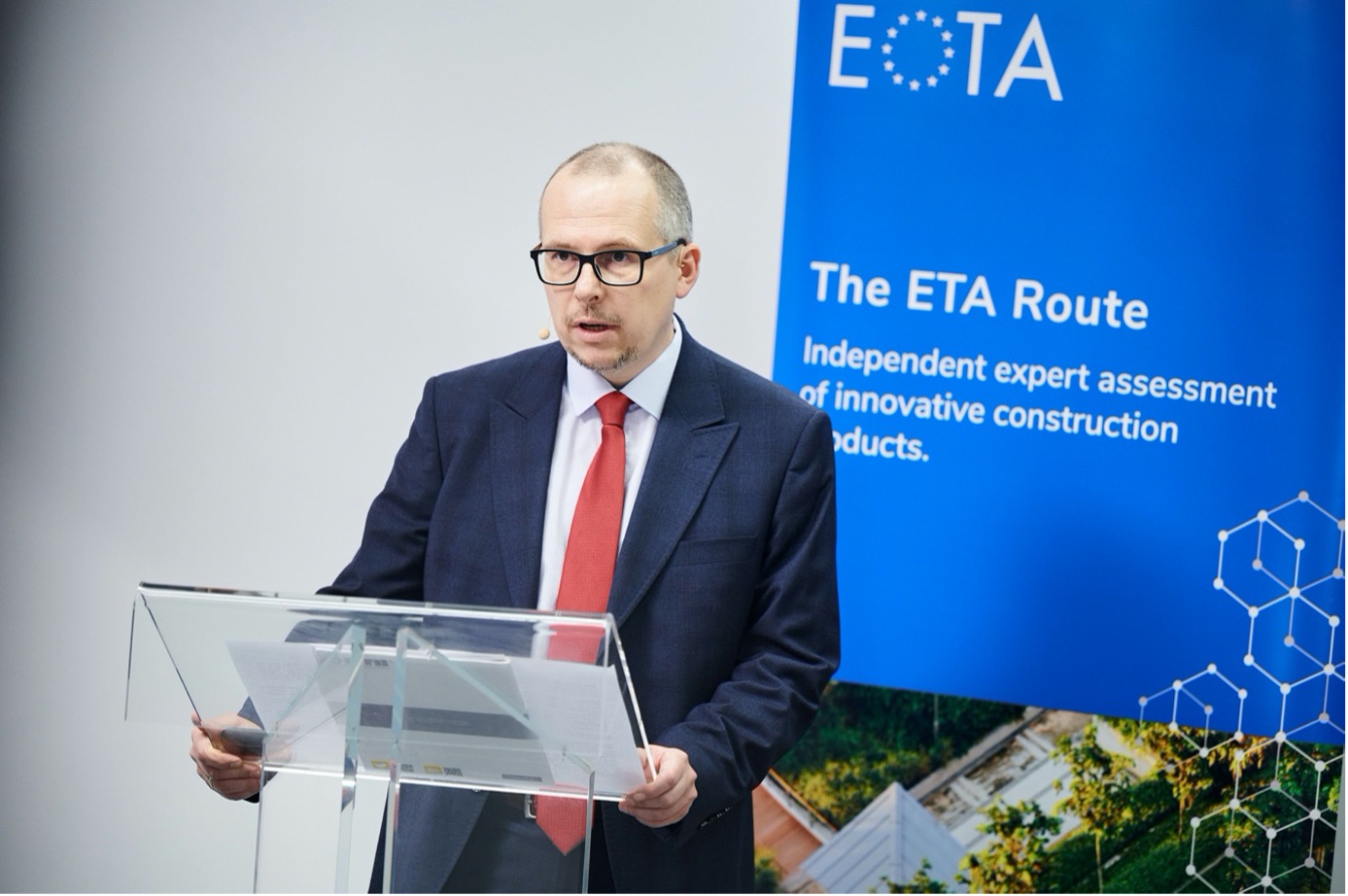 EOTA President Sebastian Wall (ITB, Poland) welcoming the guests in the studio and following online.